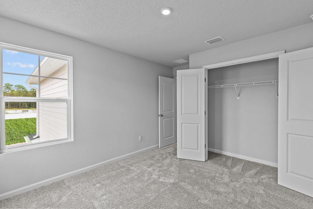 A room with a window and a door.