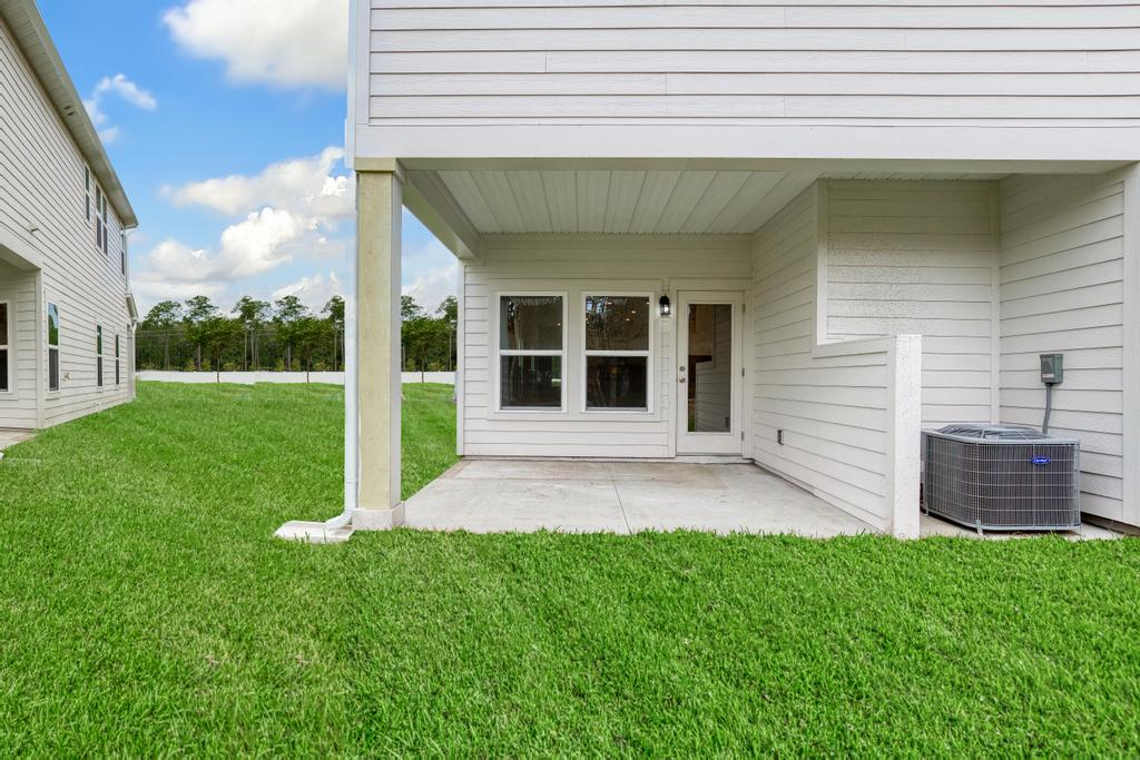 A house with a large front yard.