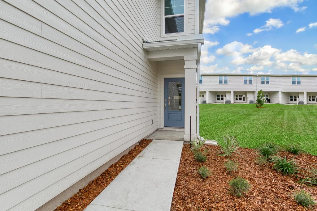 A white house with a driveway.