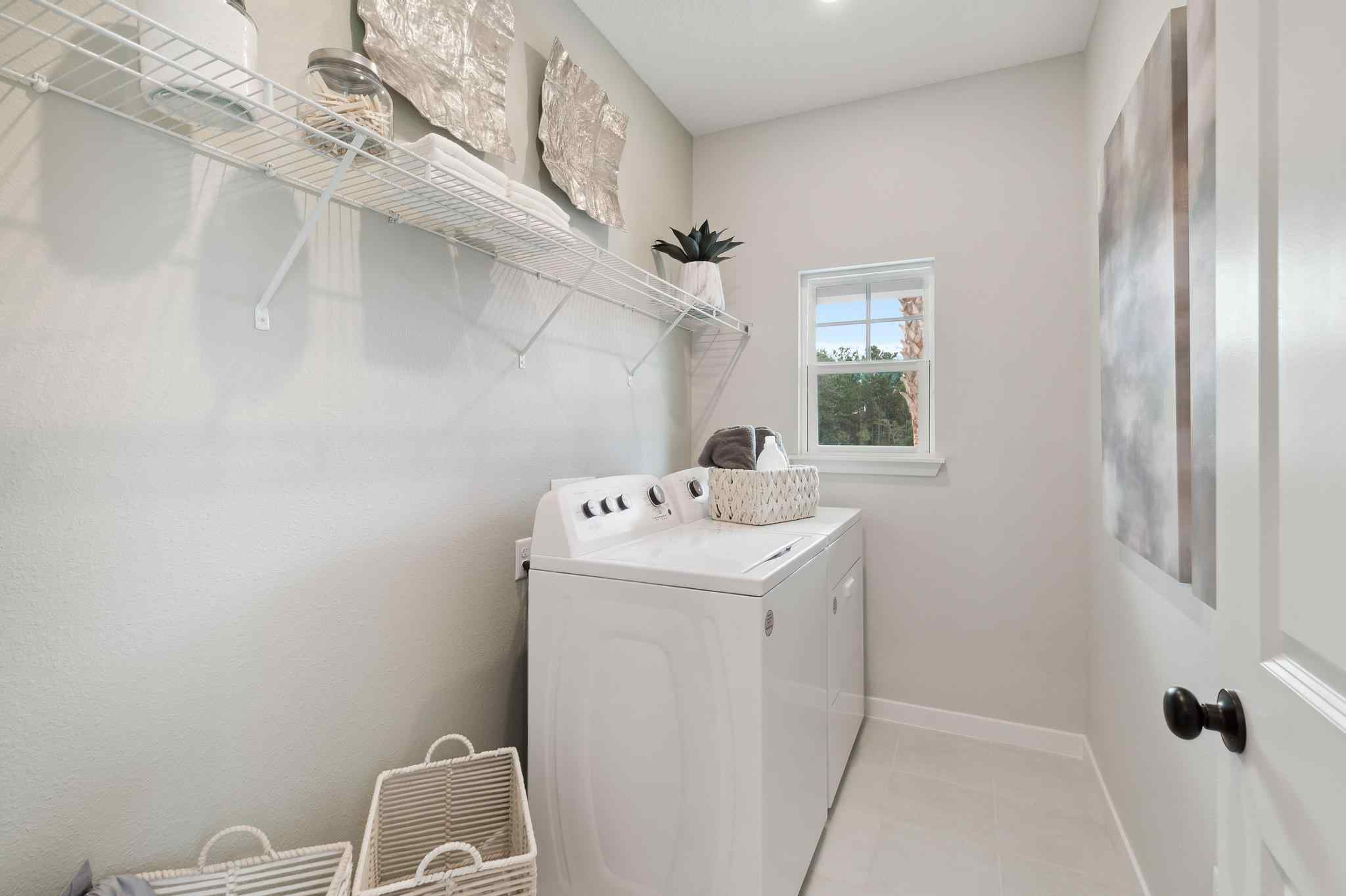 A white bathroom with a white shower curtain.