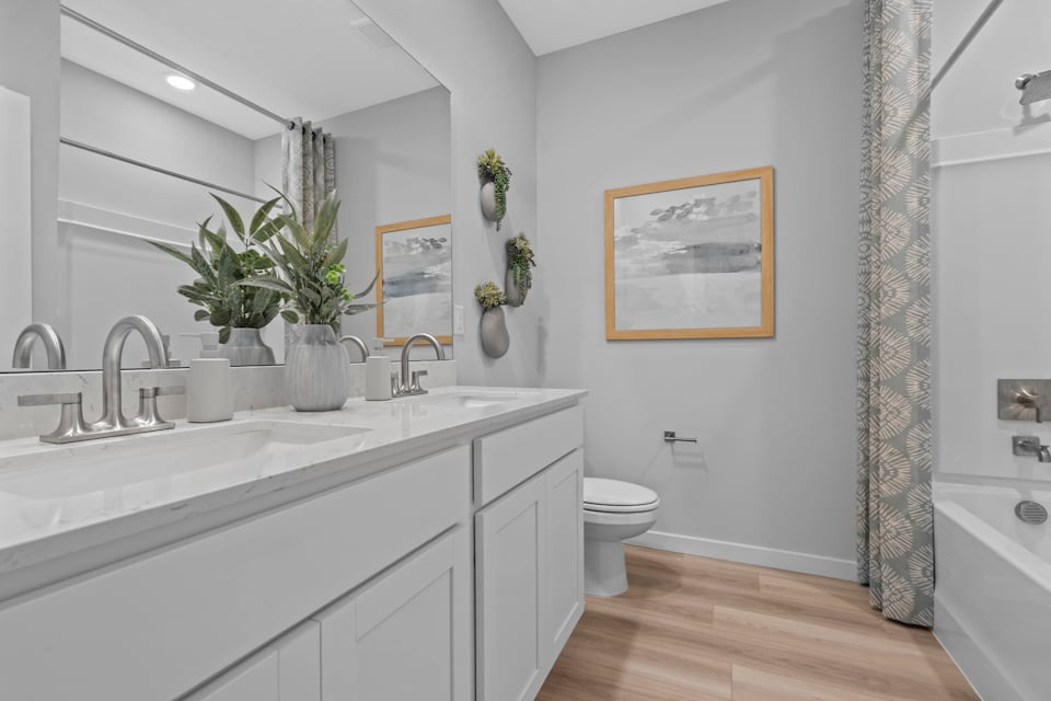 Coronado Model Home Guest Bathroom with Tub and Shower at Reserve East in Flagler Beach