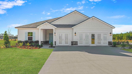 A white house with a driveway.
