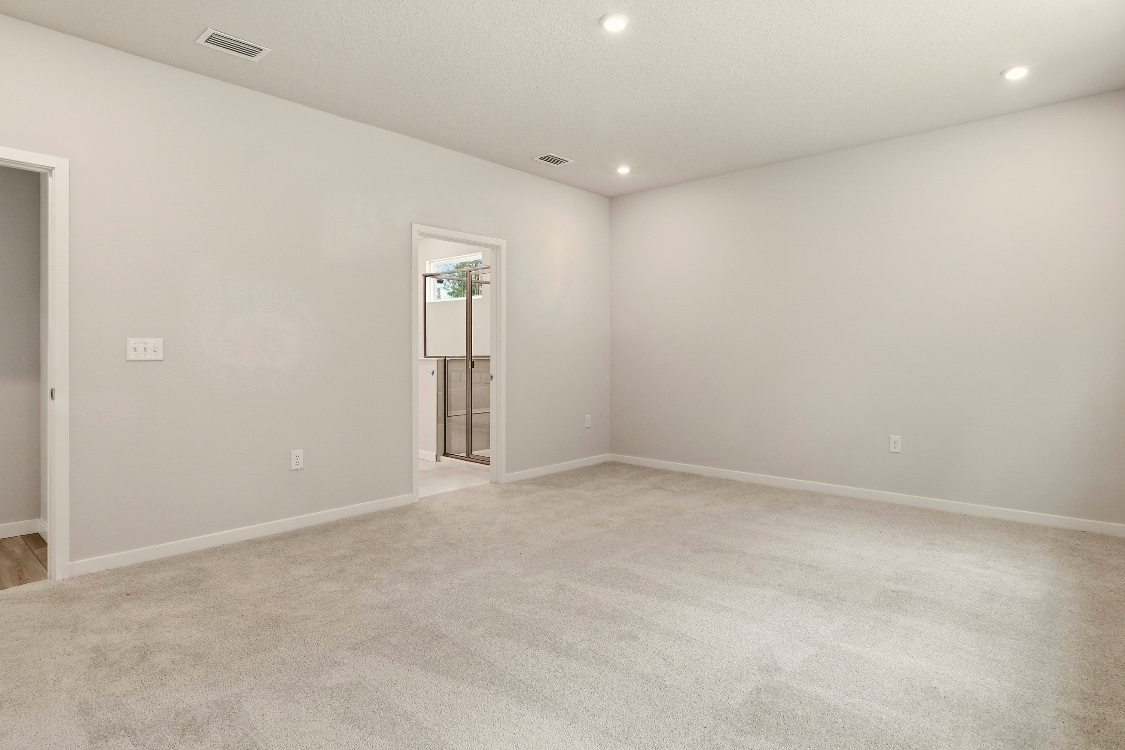 A room with a door and a window.