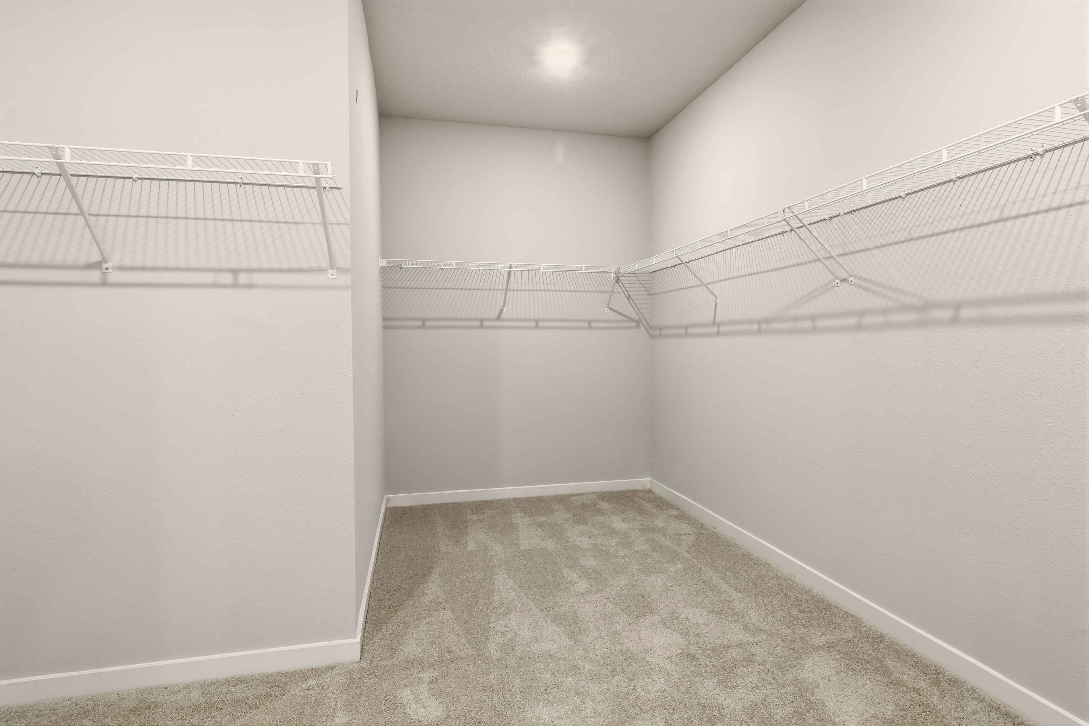 A hallway with white walls.