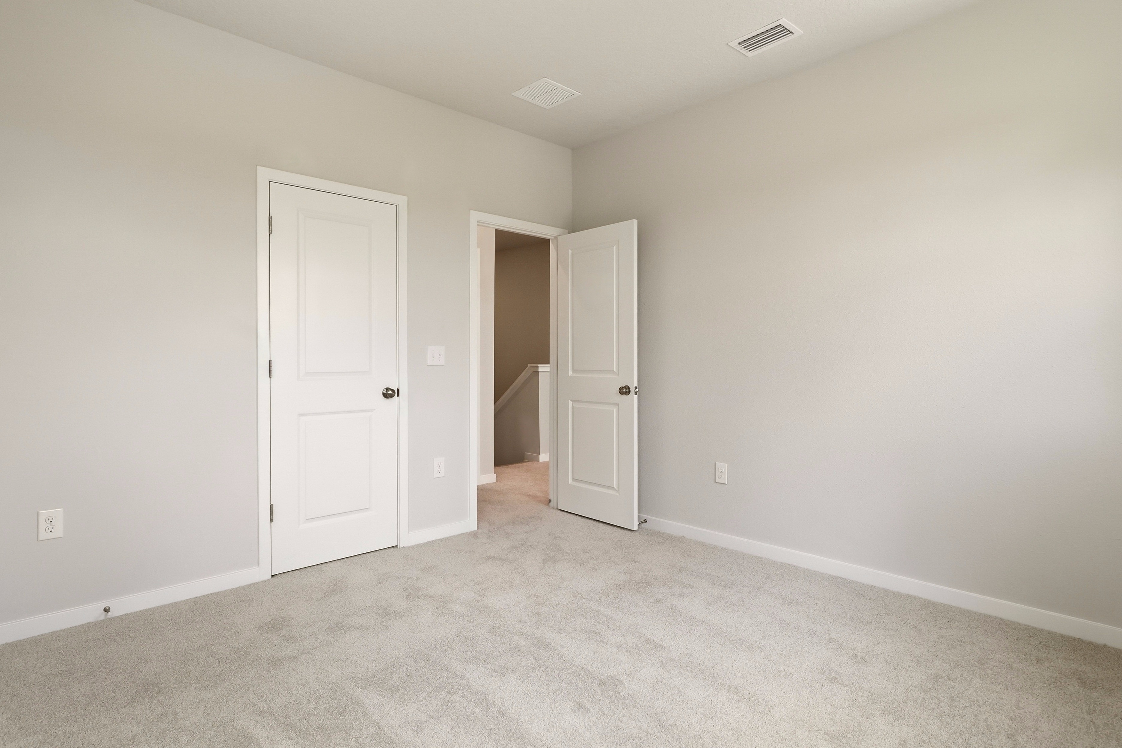 A room with white doors.