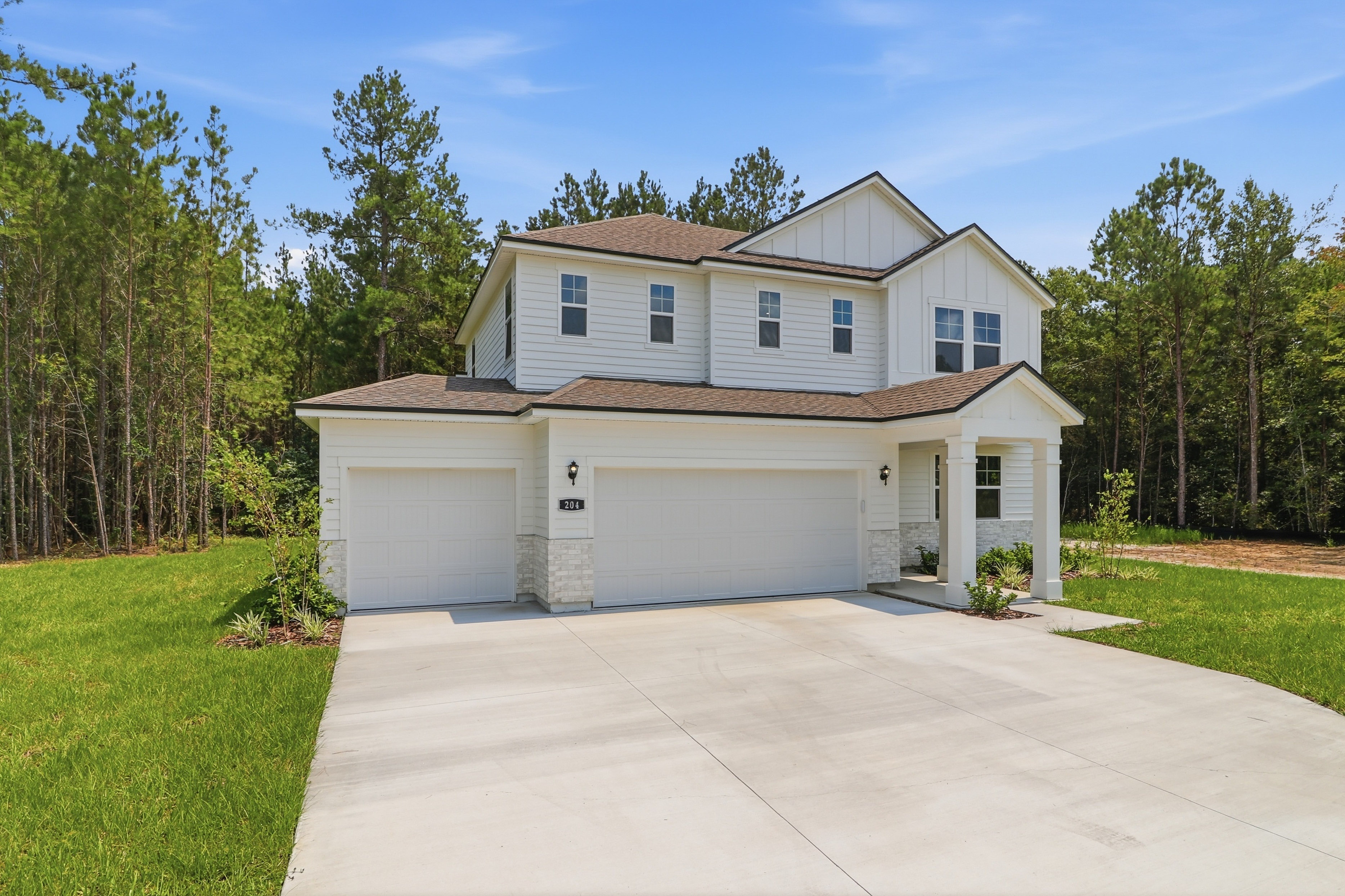 A house with garages and trees.