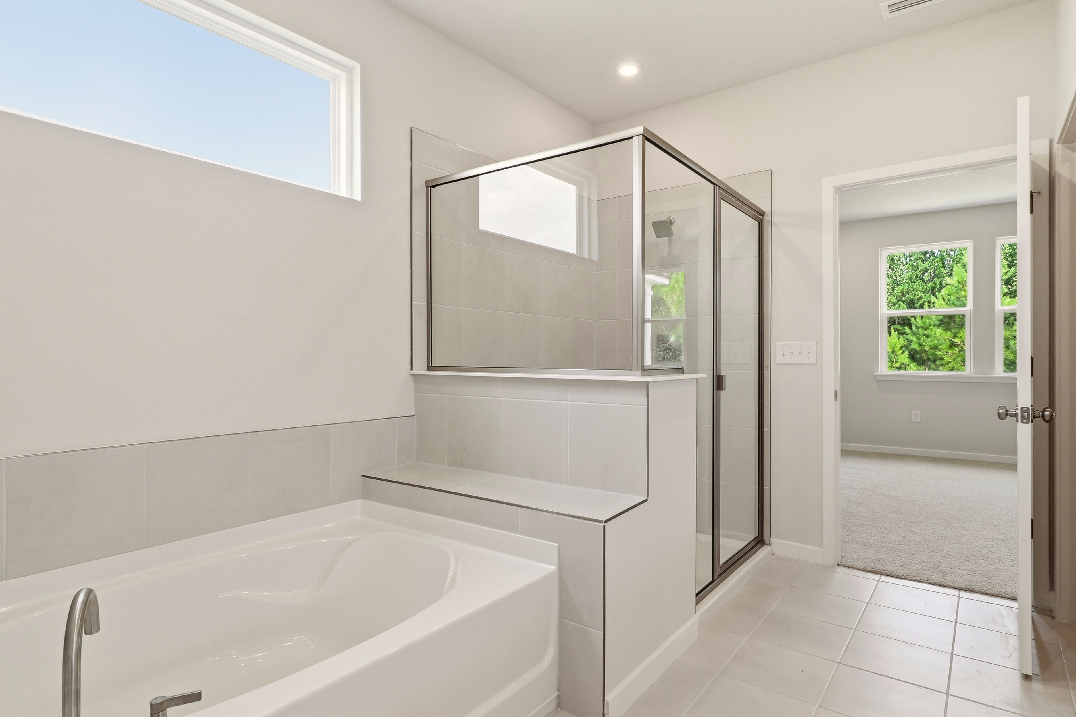 A bathroom with a glass shower.