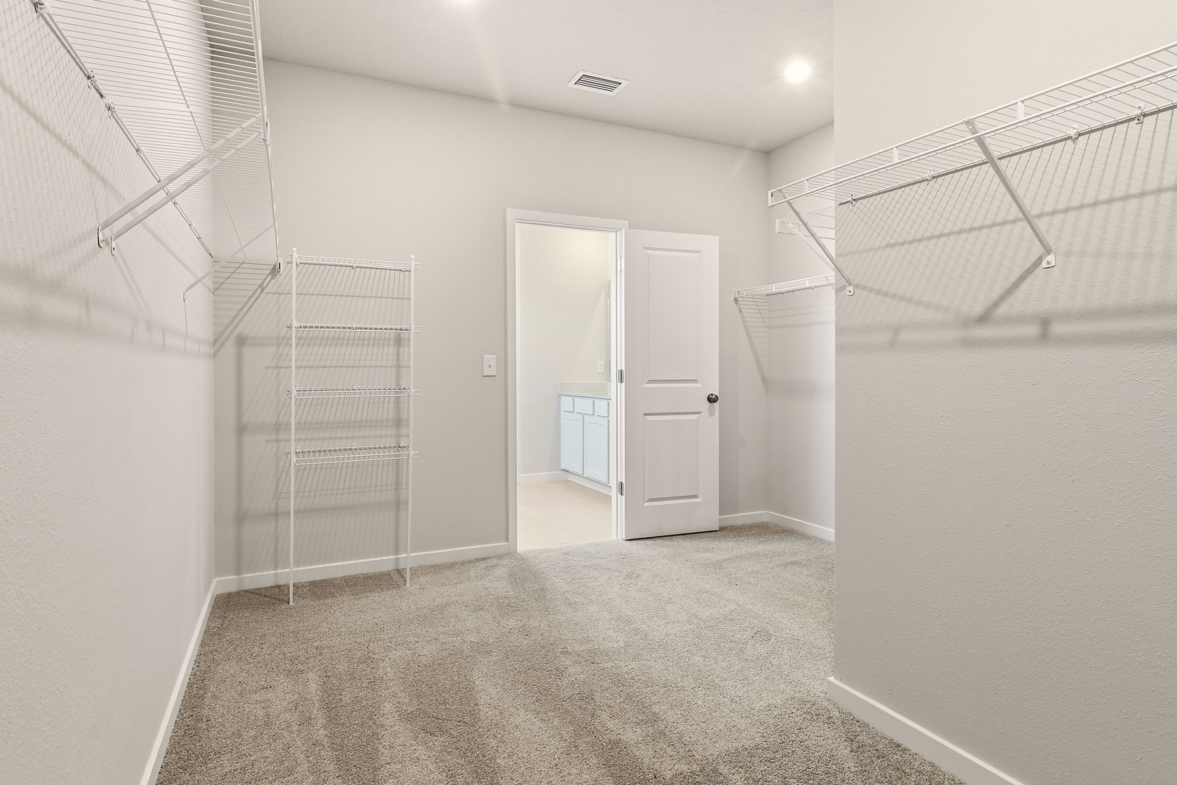 A hallway with white walls.