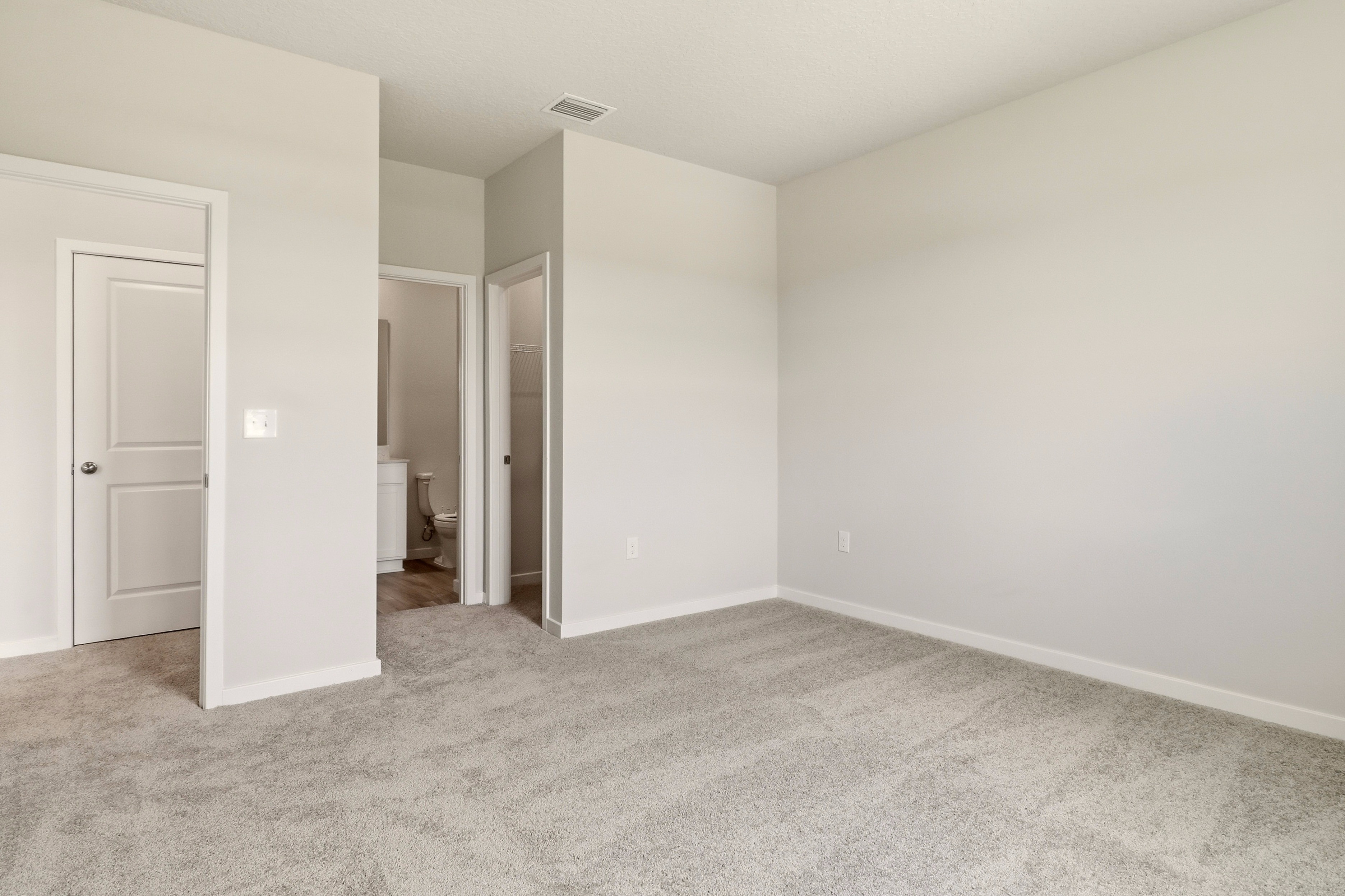 A hallway with white walls.