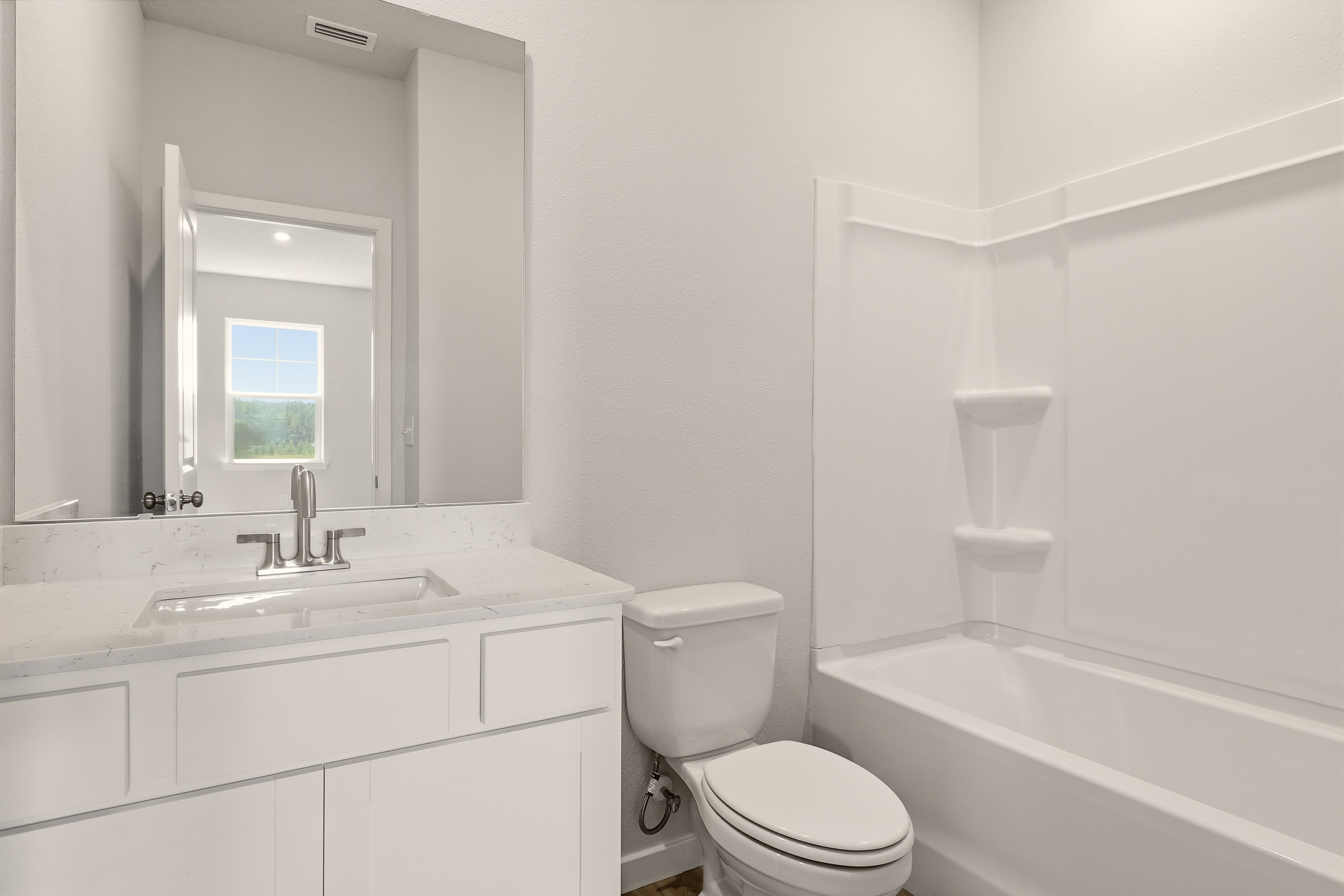 A bathroom with a toilet and sink.