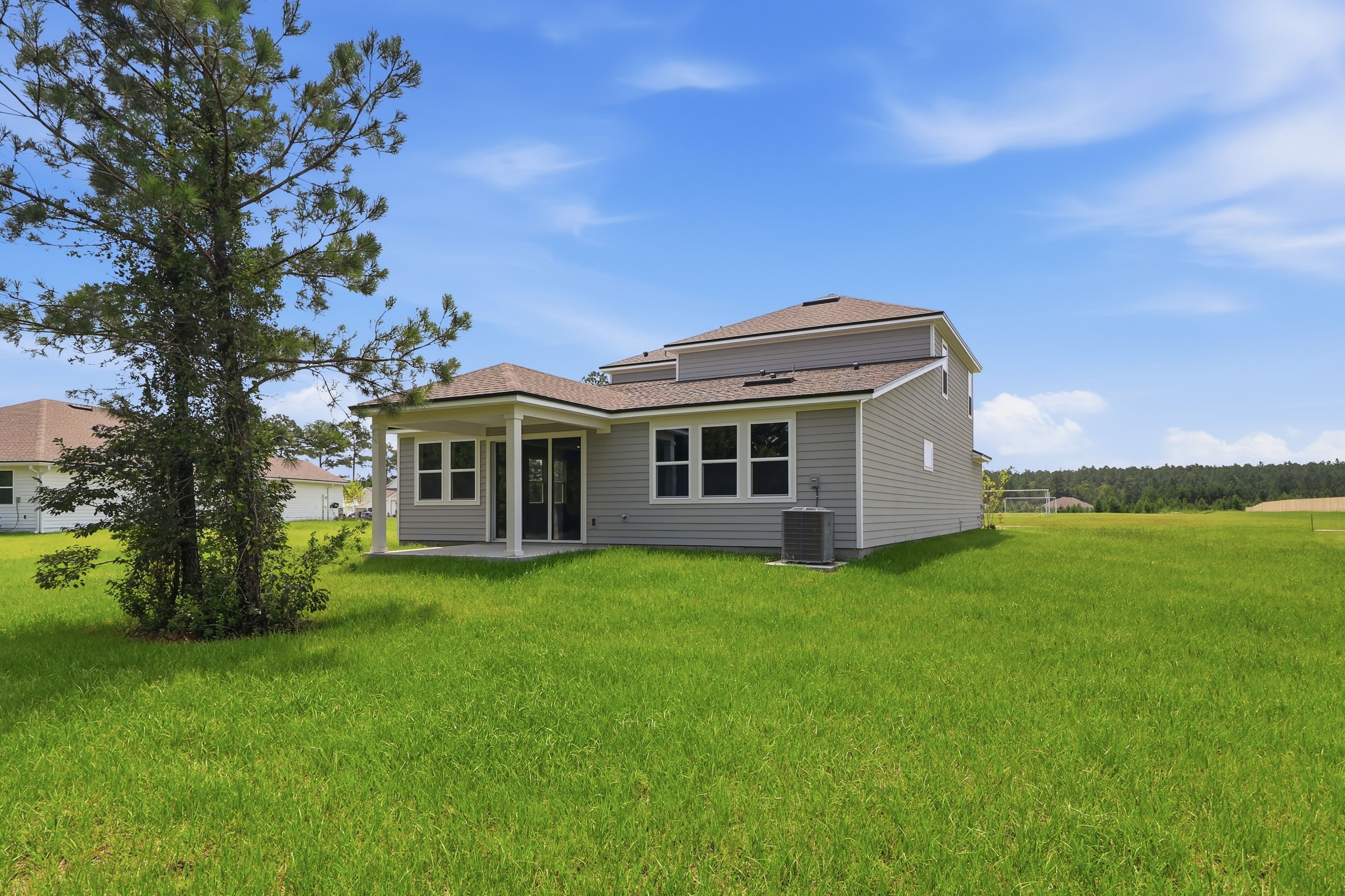 A house in a grassy field.