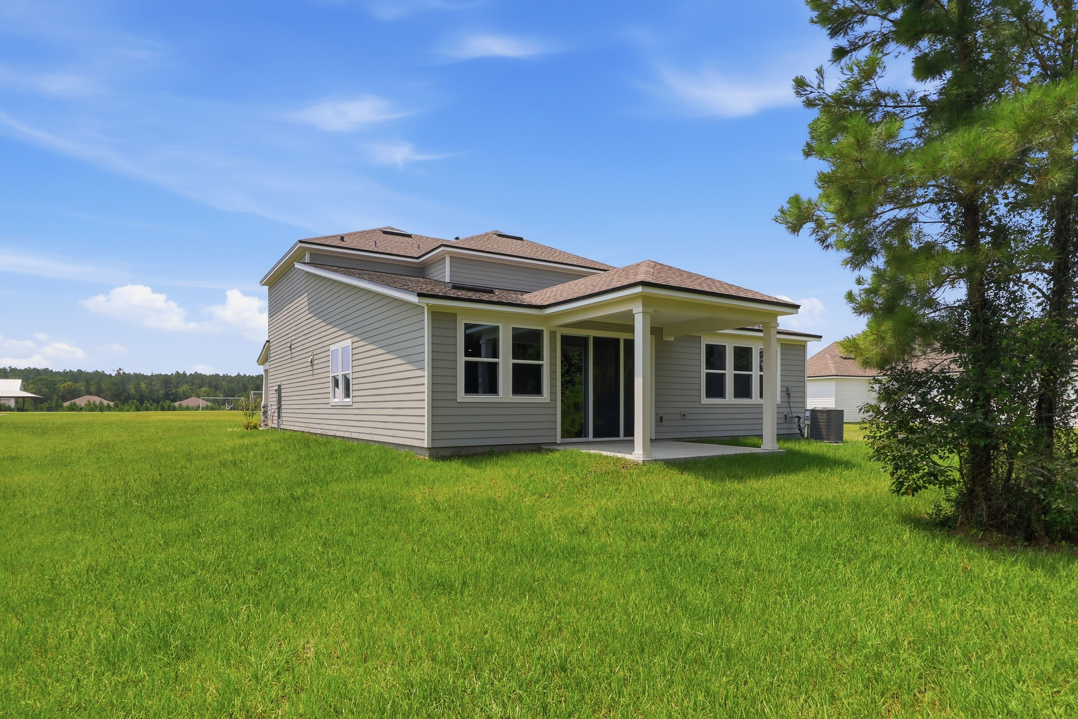 A house with a grass yard.