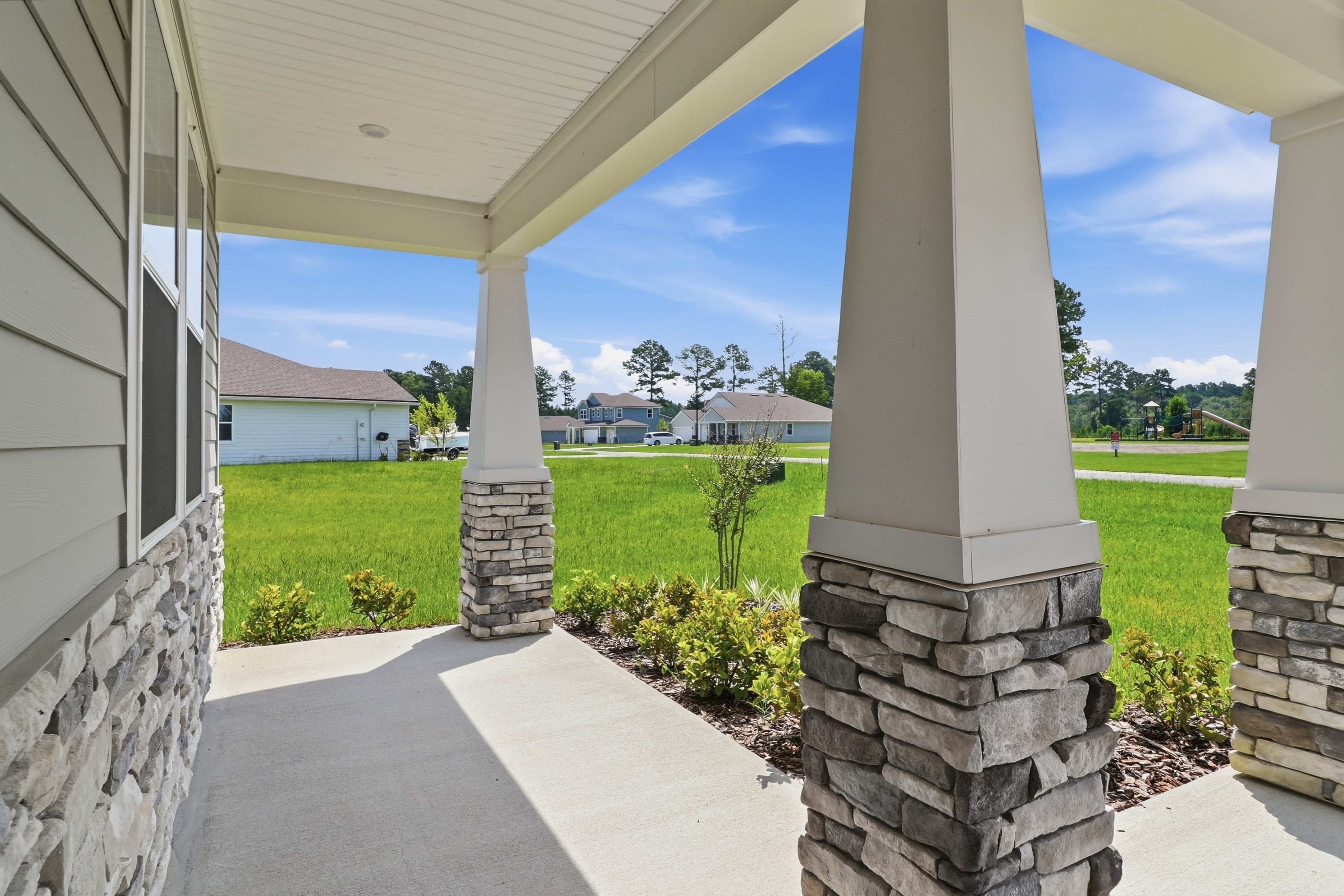 A stone pillar with columns and a walkway.
