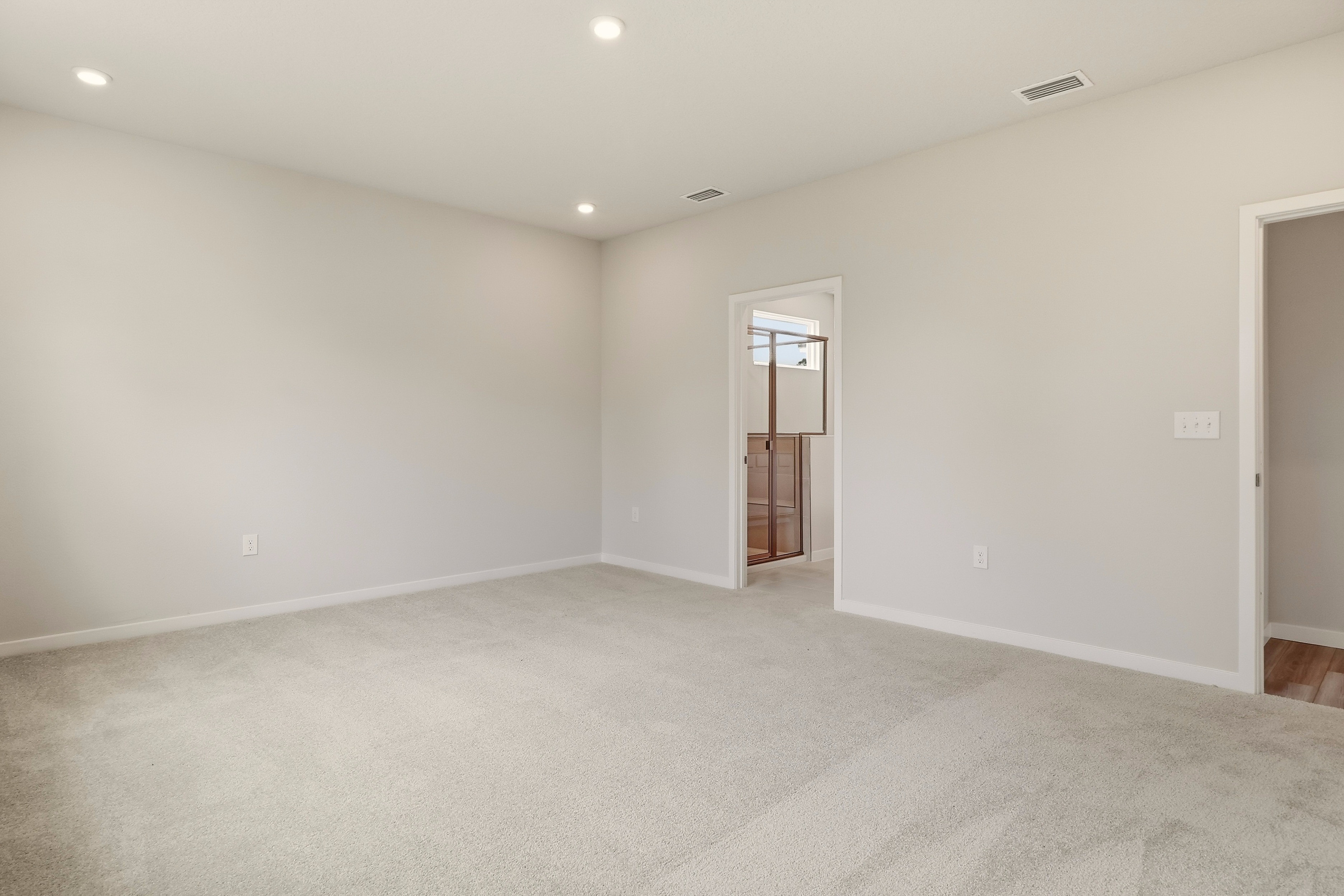 A room with a door and a window.