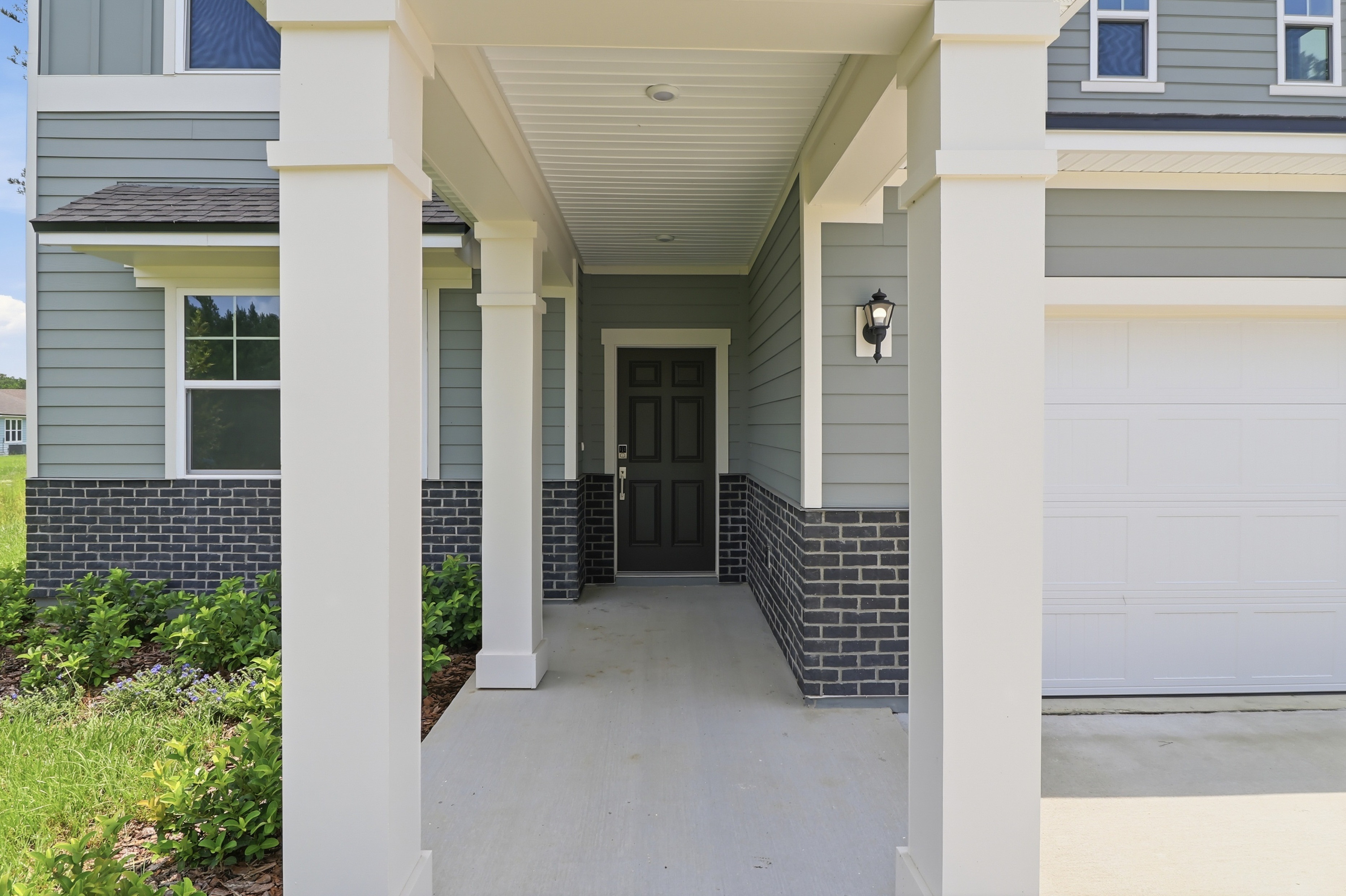 A house with pillars and a door.