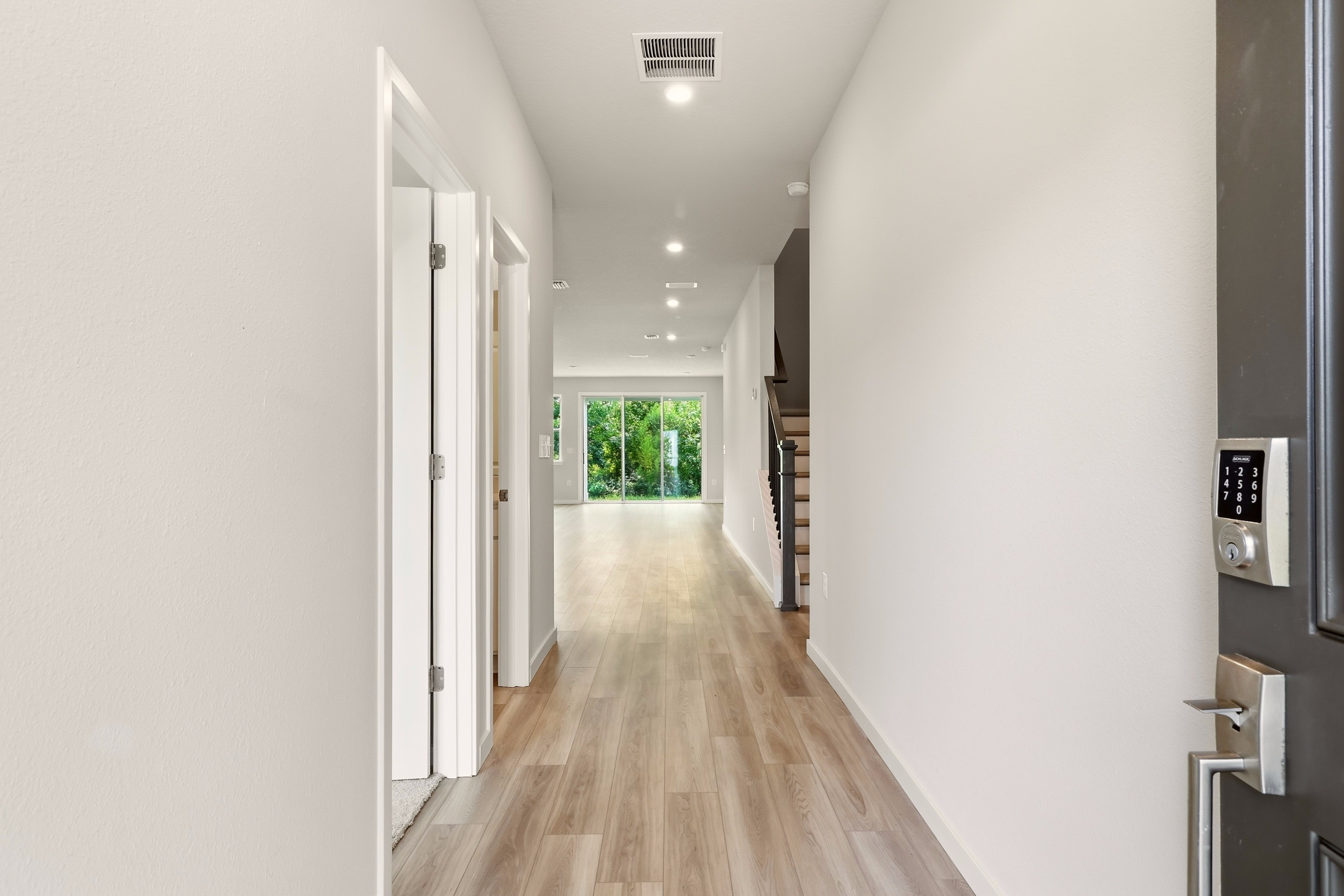 A hallway with white walls.