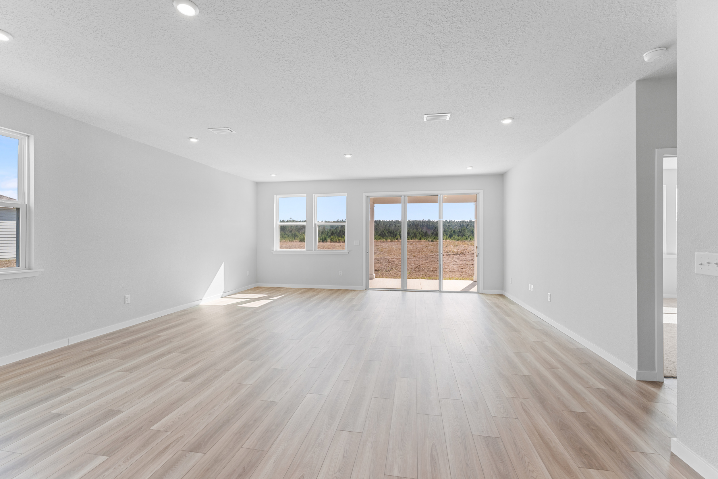 Lot 595 Open Great Room with Sliding Doors to Covered Patio at NorthShore