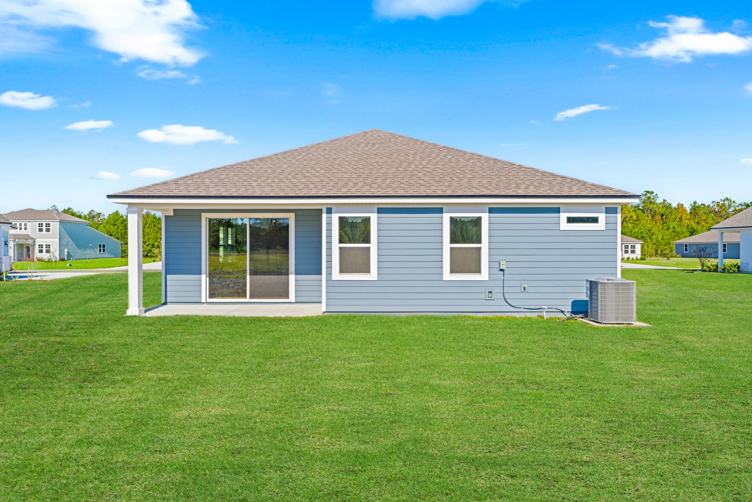 A house with a grass yard.