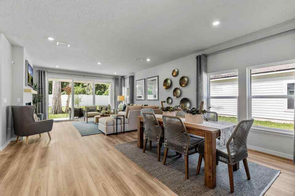 A large dining room with a large table and chairs.