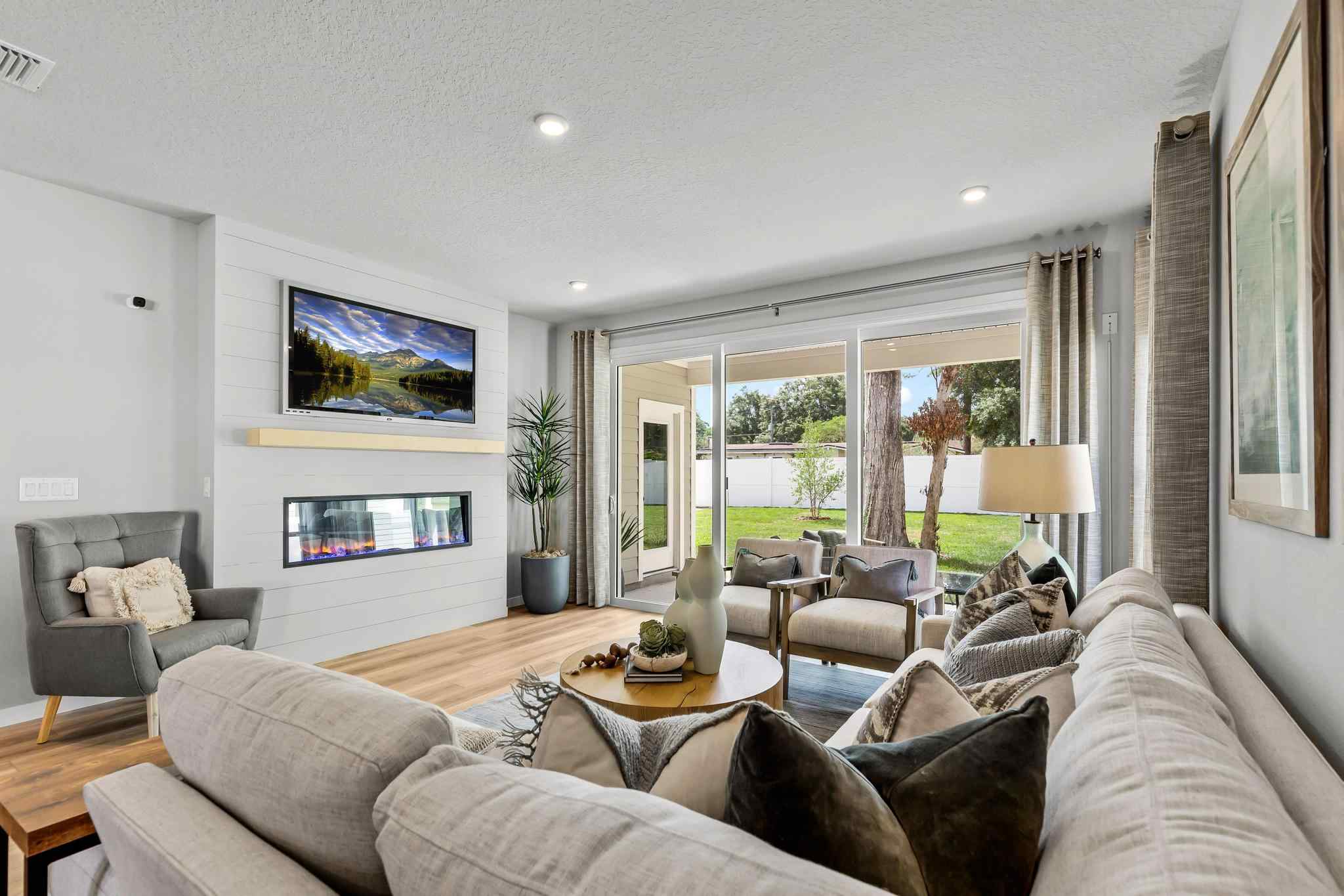 A living room with a large window.