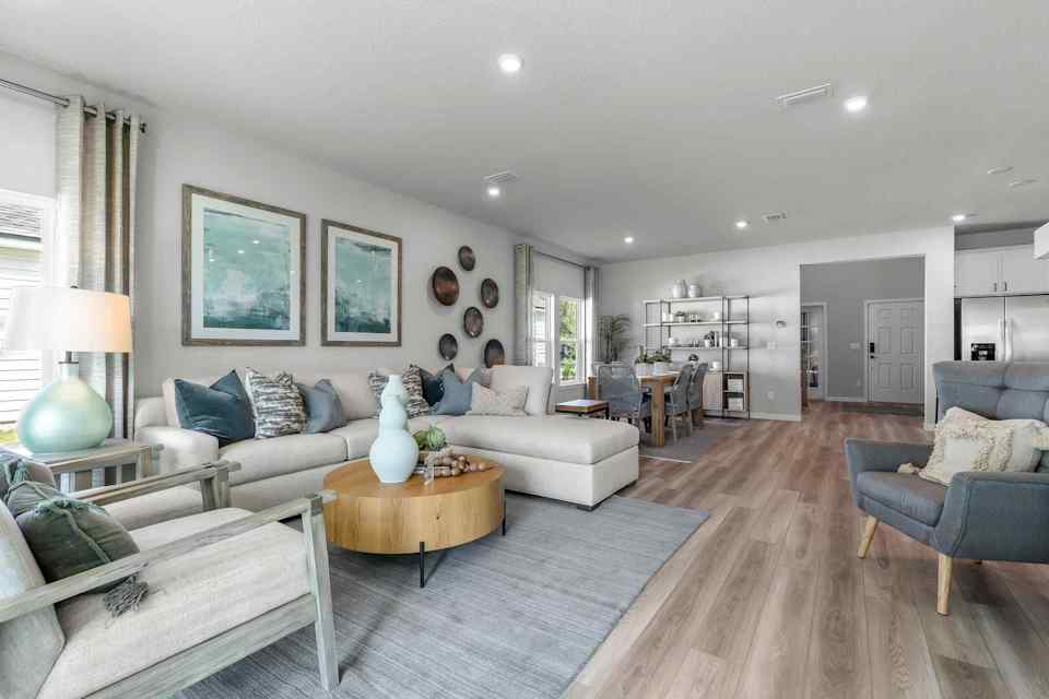 A living room with a couch and a table.