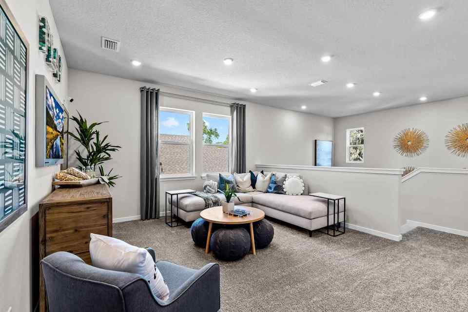 A living room with a couch and a table.