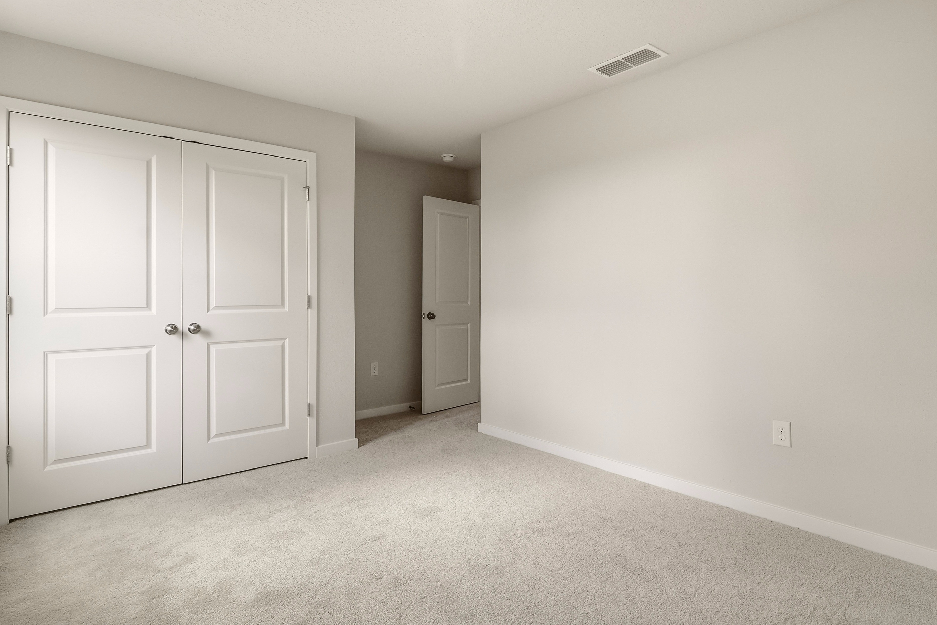 A room with white doors.