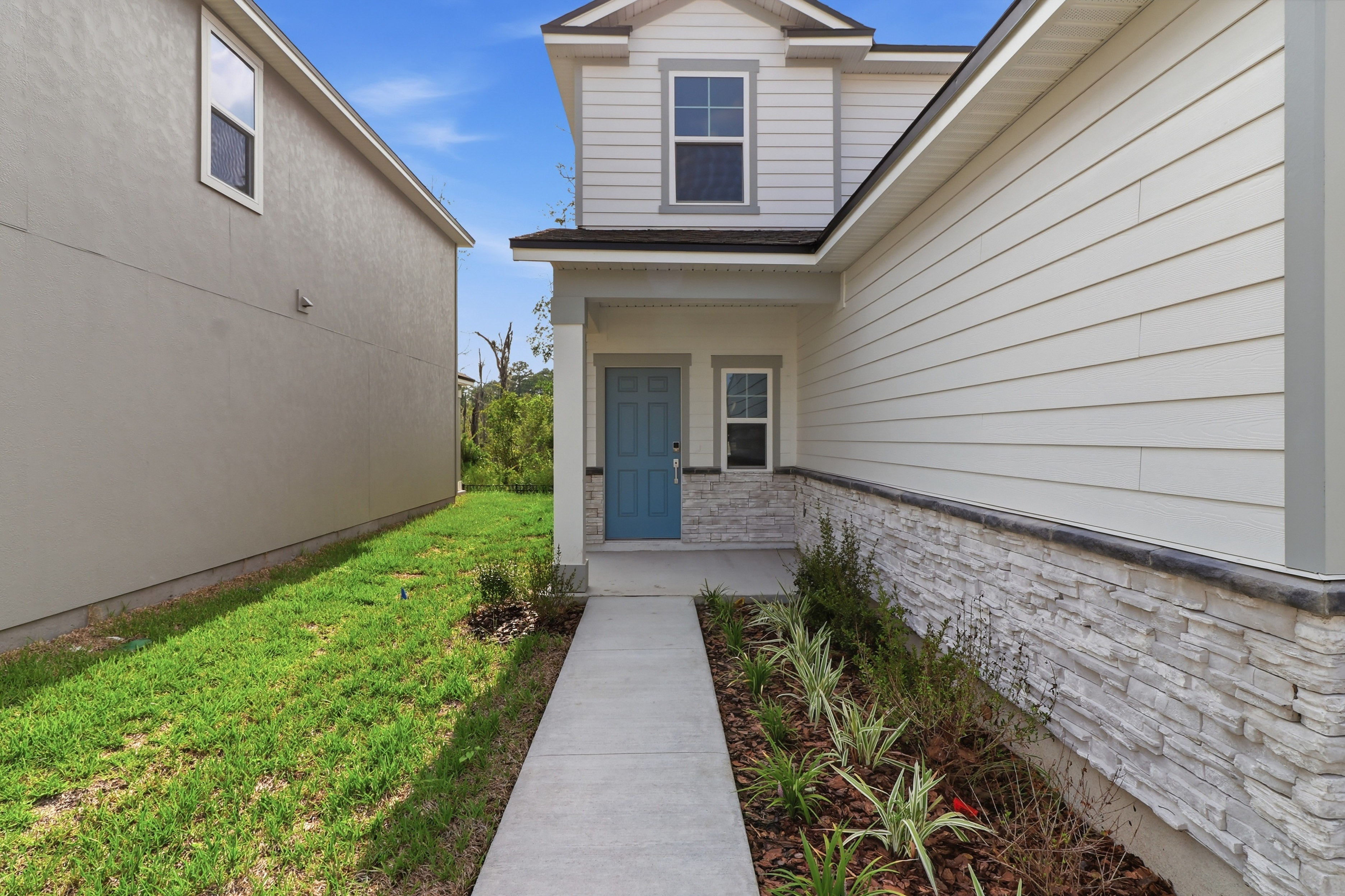 A house with a stone path.