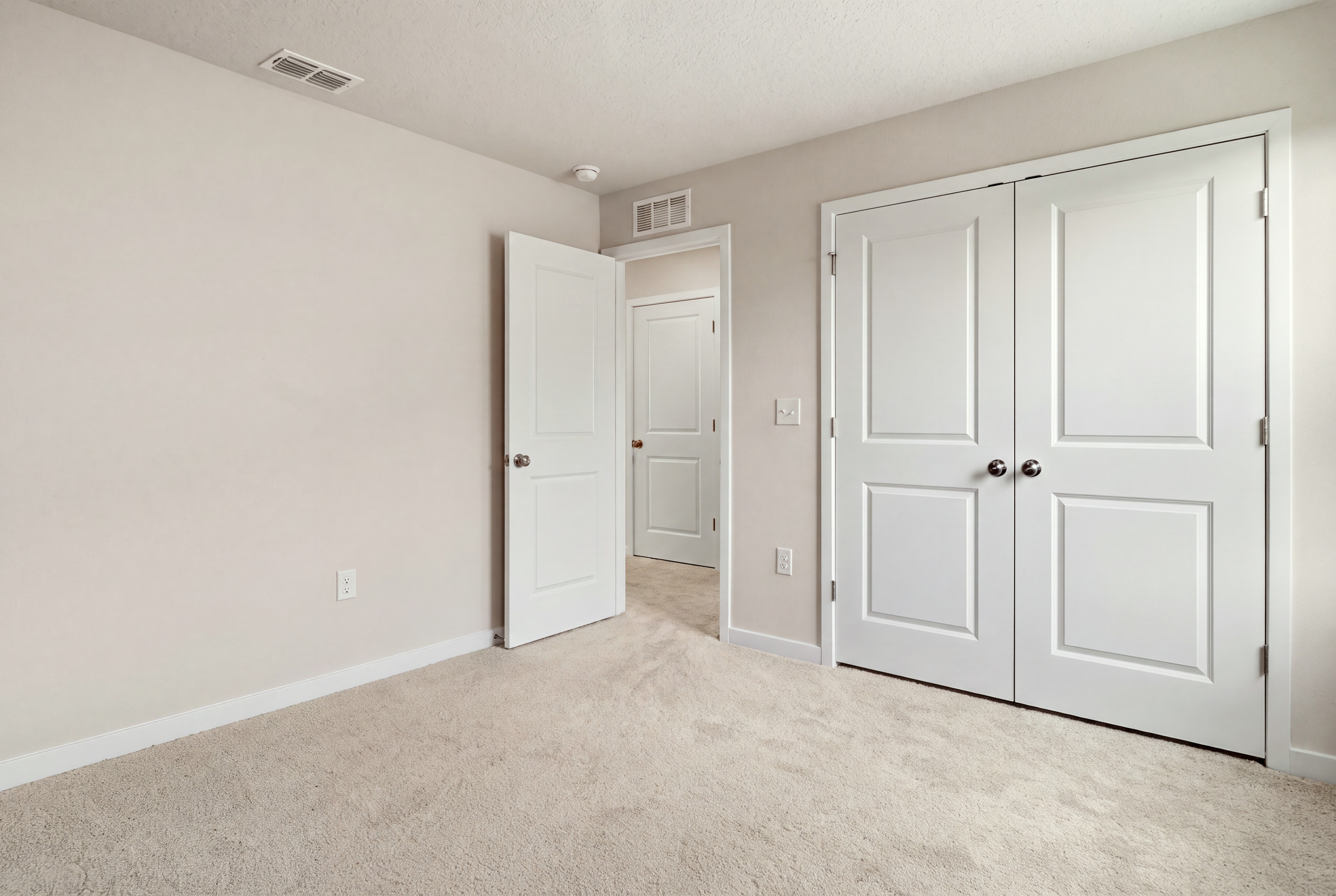 A room with white doors.
