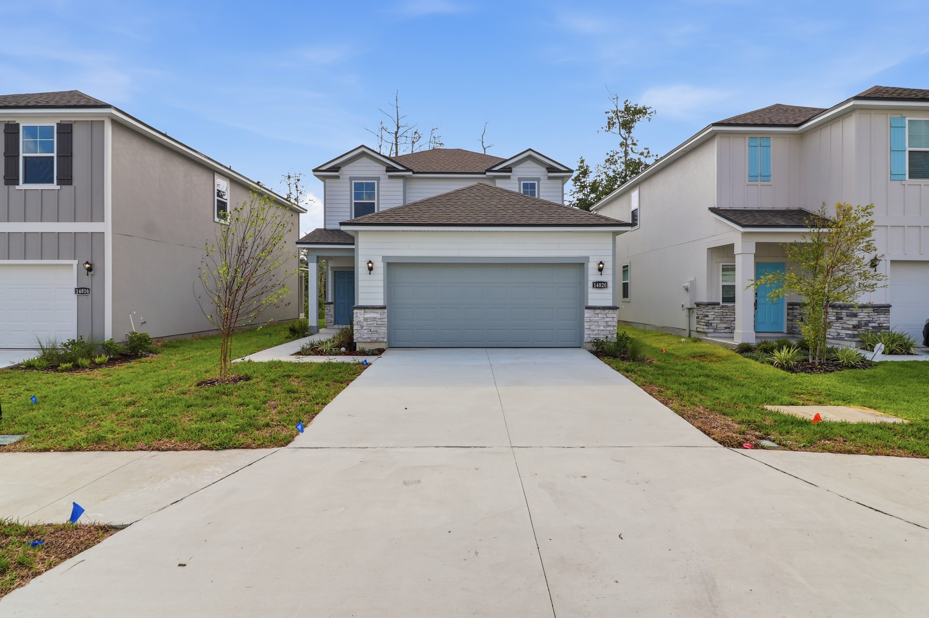 A driveway leading to a house.