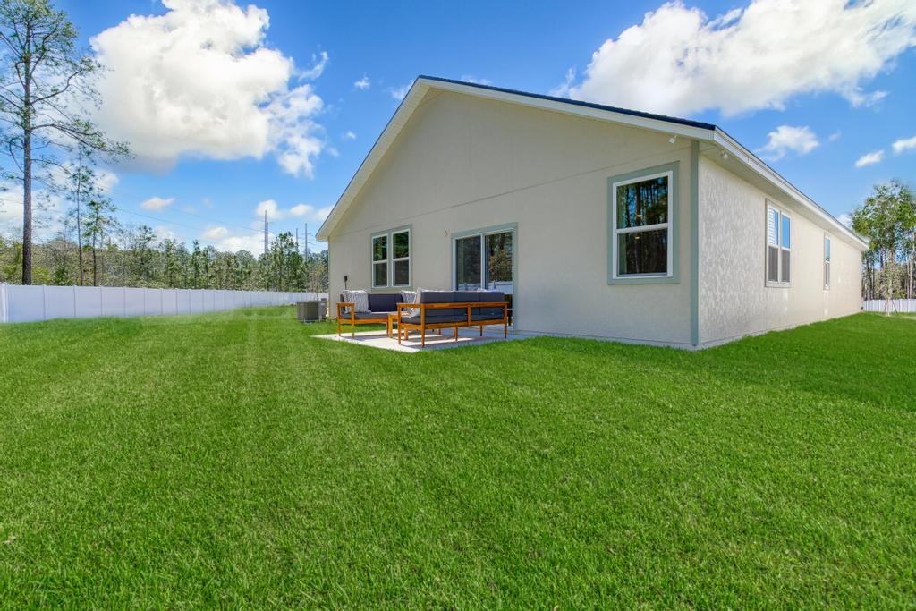 A house with a lawn in front.