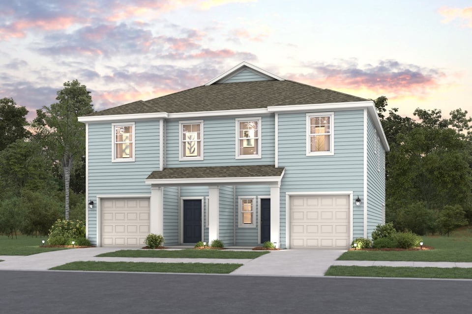 A blue house with garages.