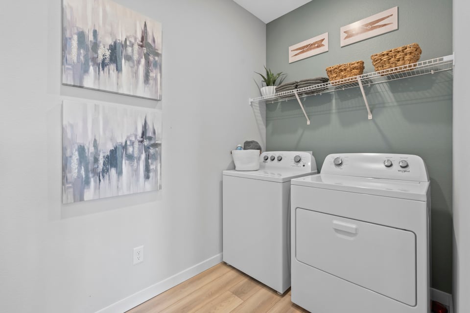 Coronado Model Home Laundry Room with Washer and Dryer at Reserve East in Flagler Beach