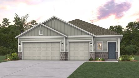 A house with garages and trees.