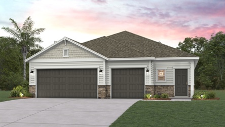 A house with garages and trees.