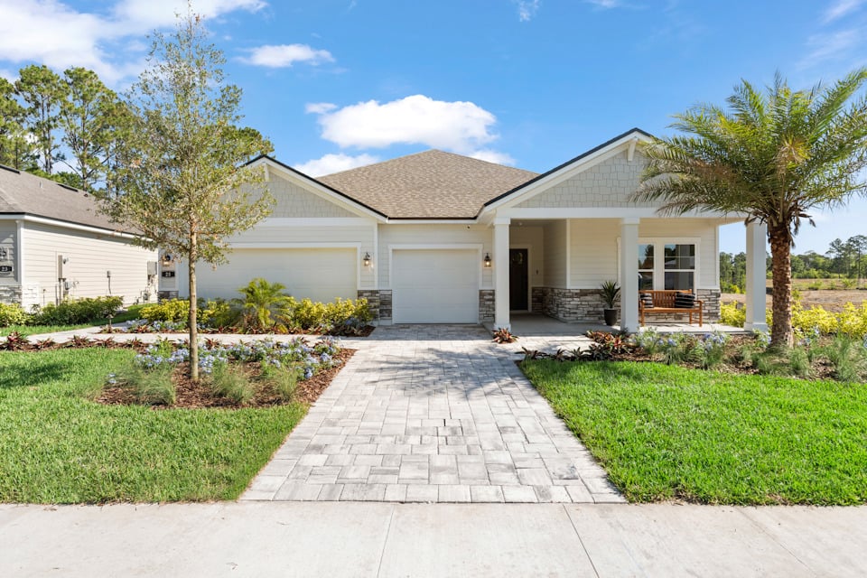 Kenai Model Home Exterior with 3-Bay Garage at Reserve East in Flagler Beach