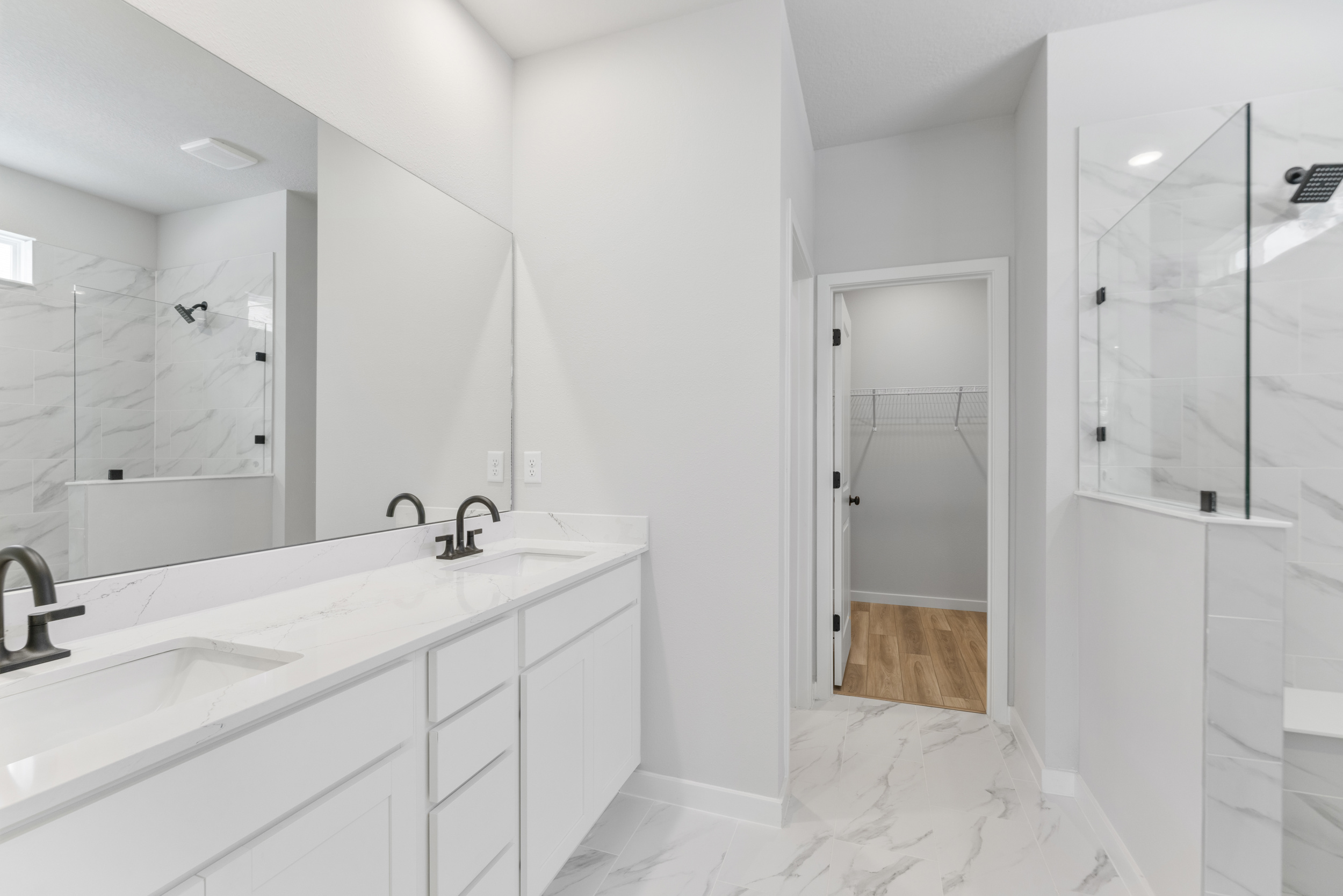 A bathroom with a glass shower.