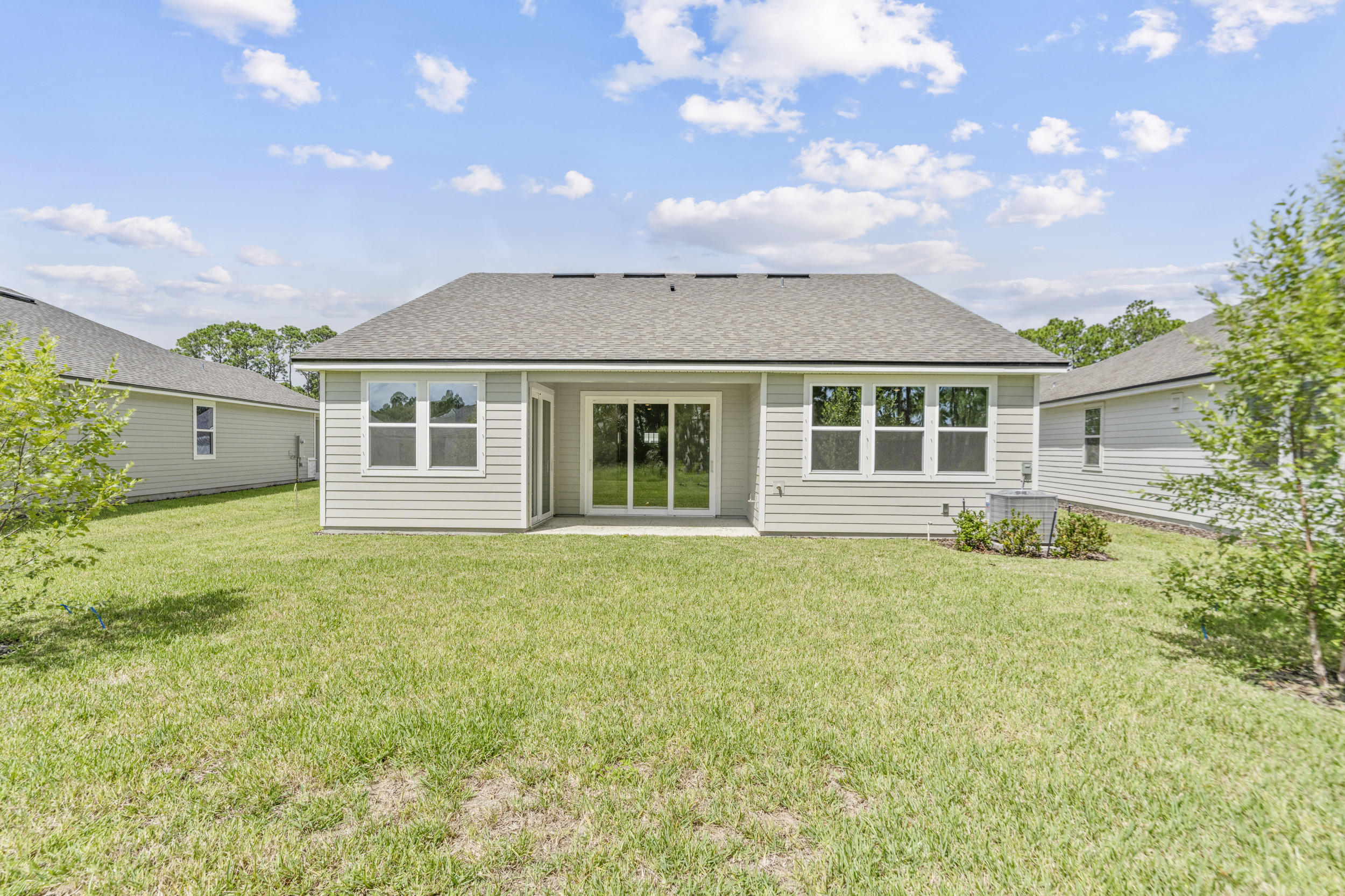 A house with a grass yard.