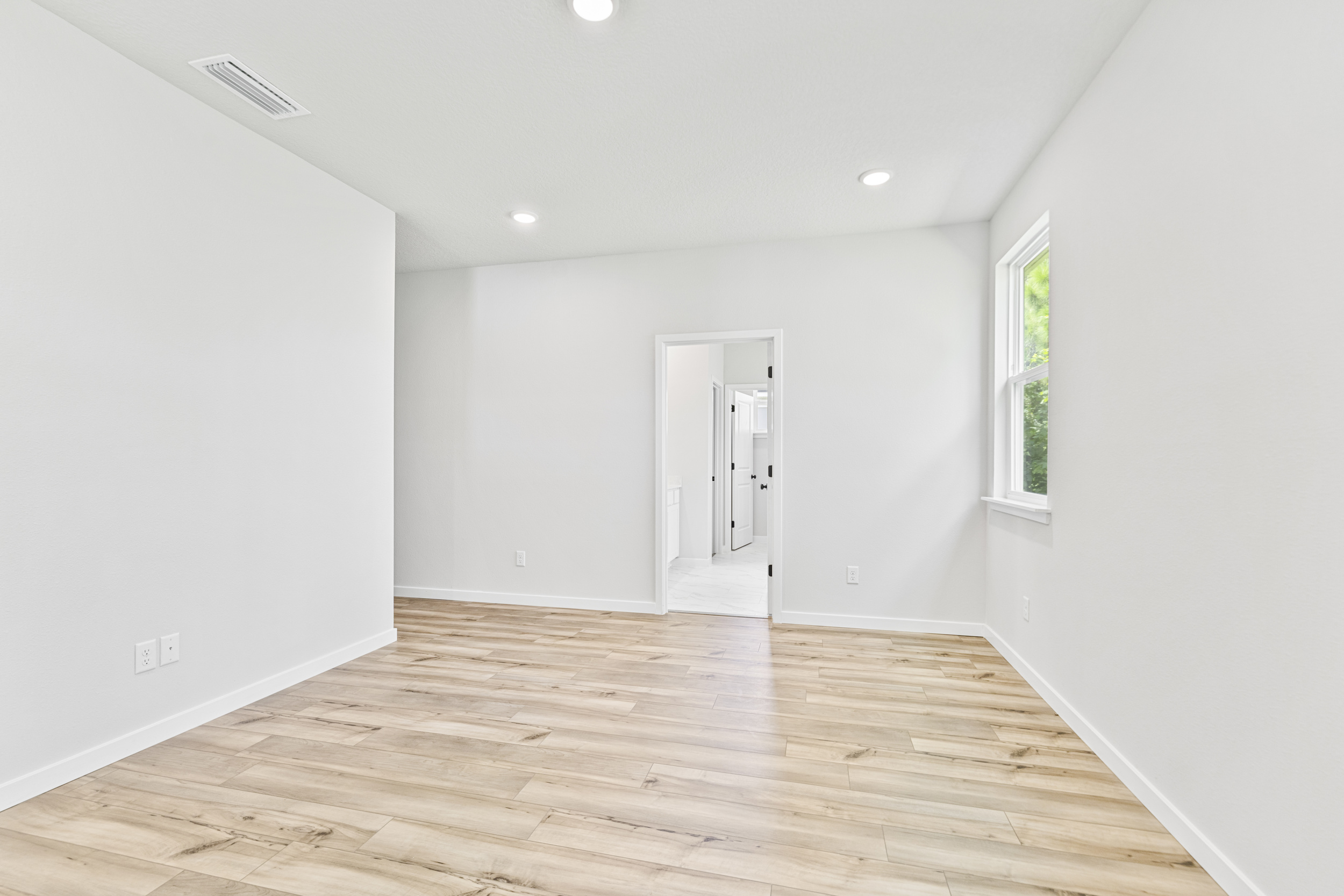 A room with a wood floor and a wood floor.