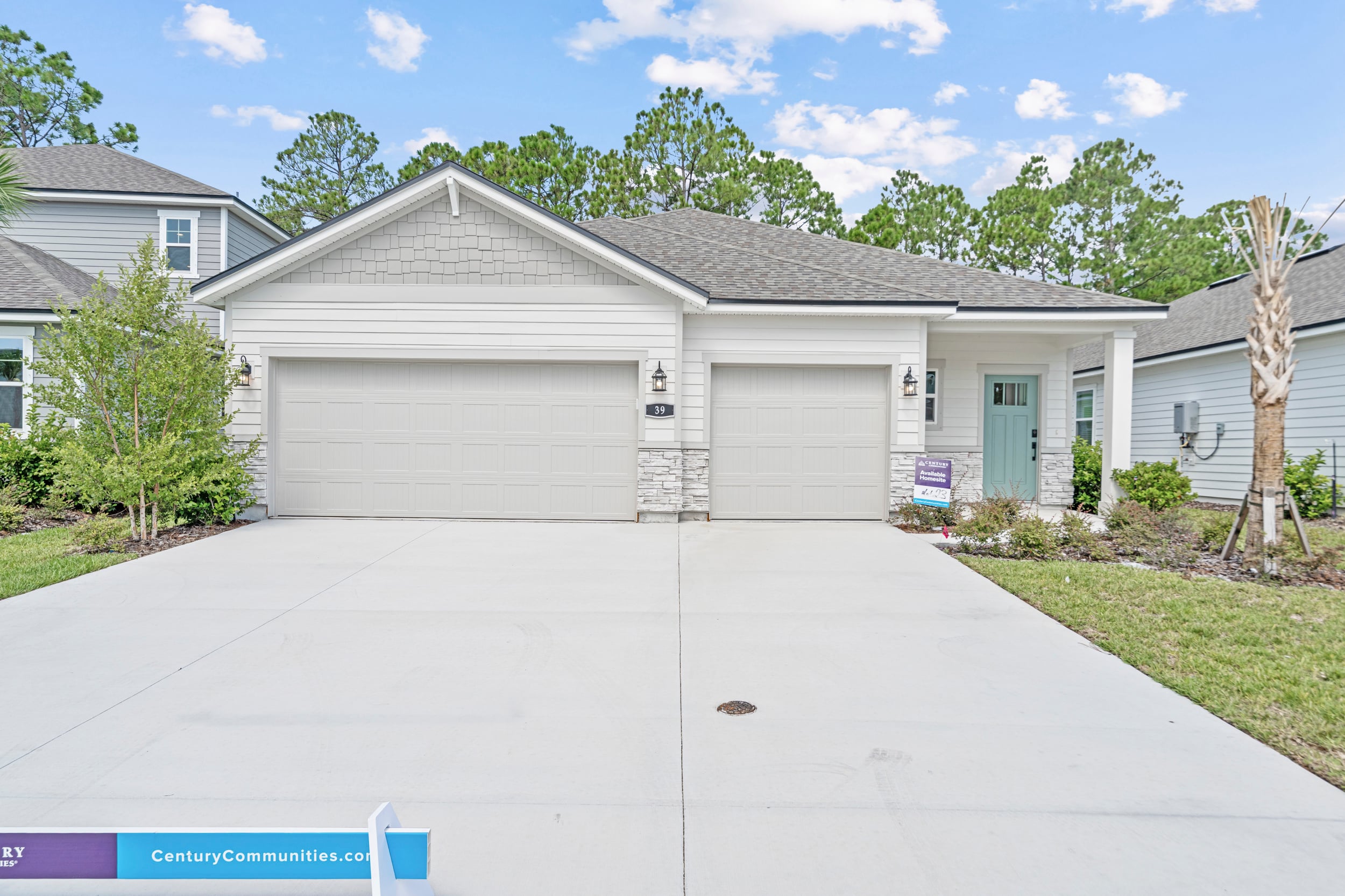 A house with garages and a driveway.