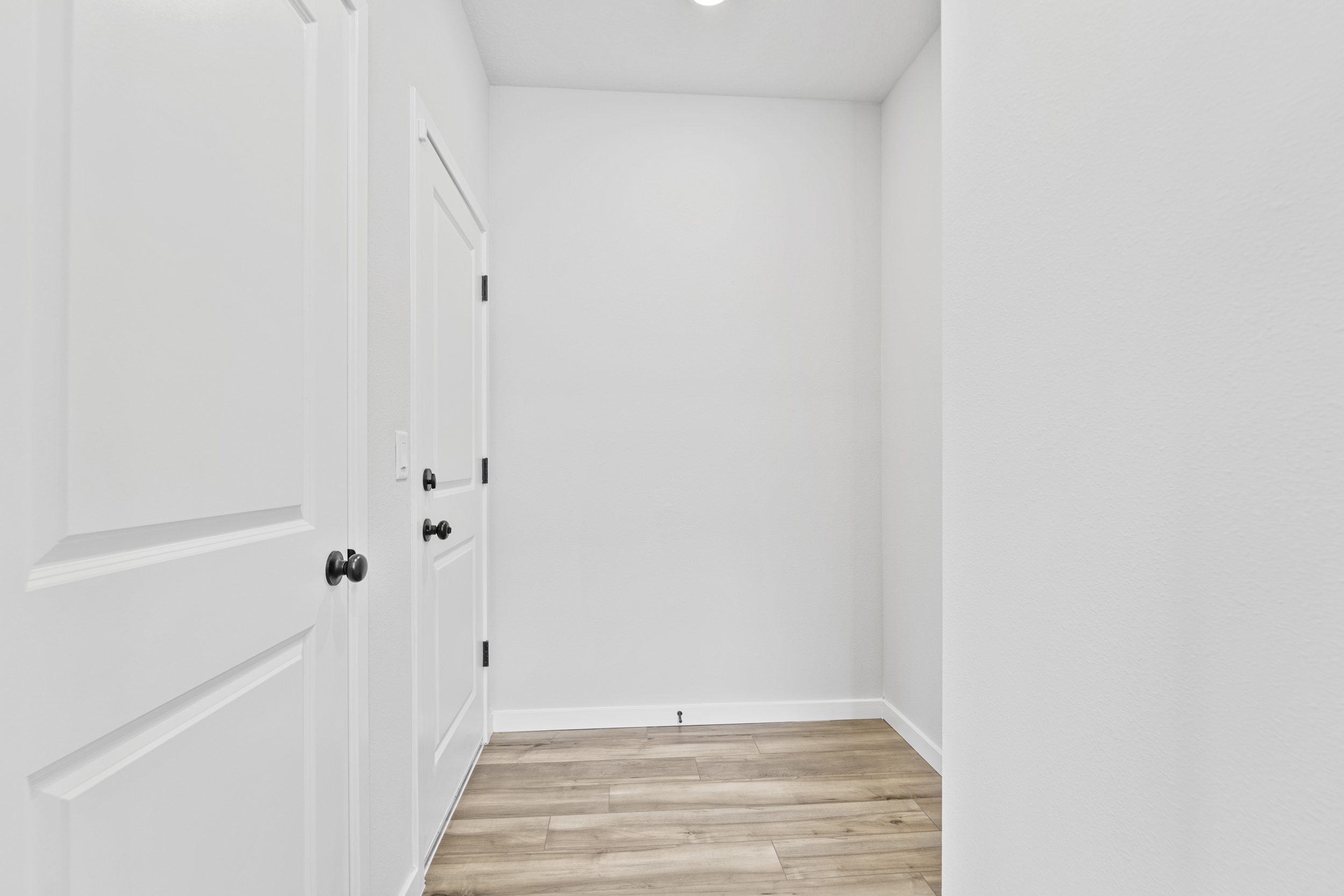 A room with white doors.