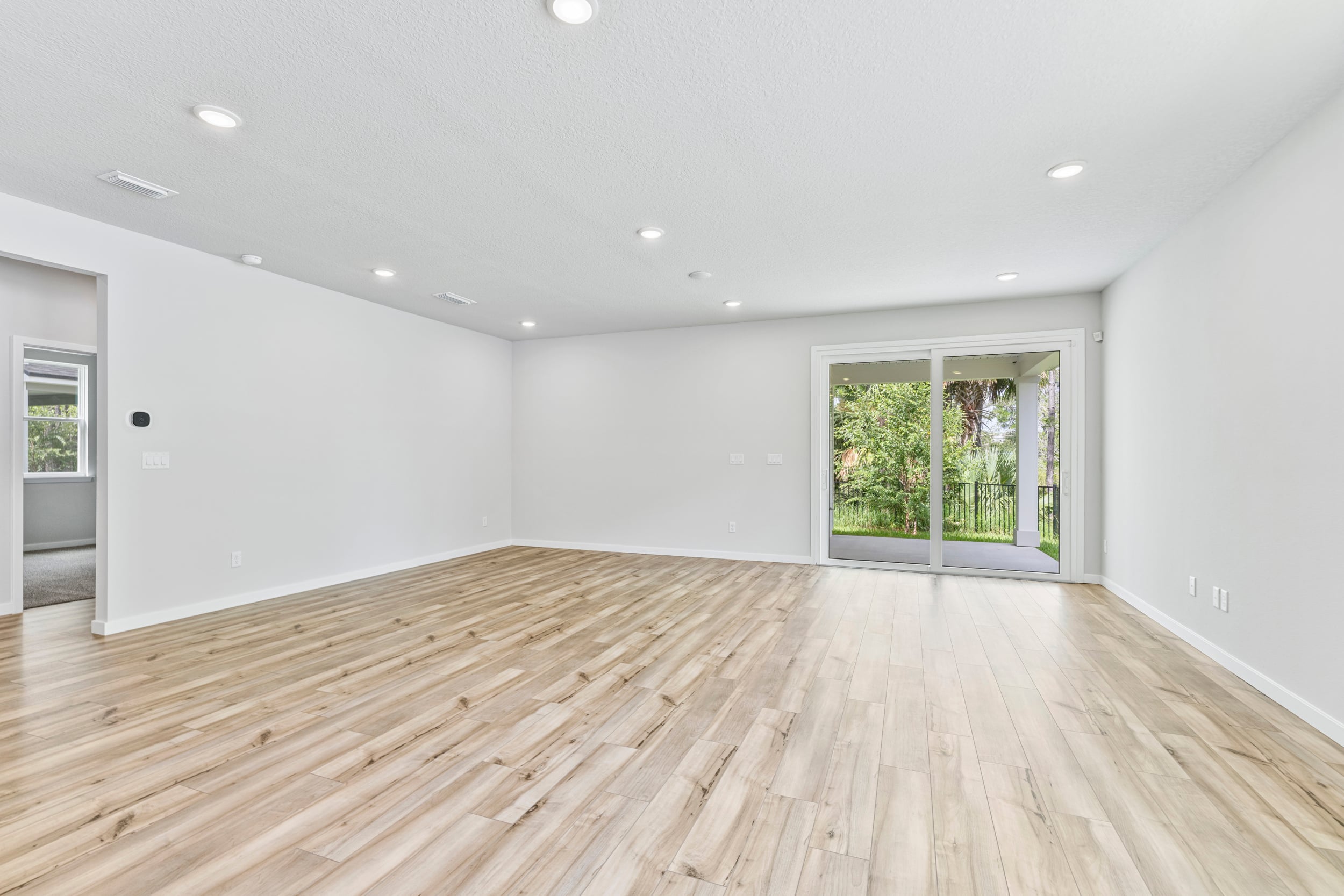 A room with a wood floor and a wood floor.