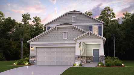 A house with a driveway and trees.