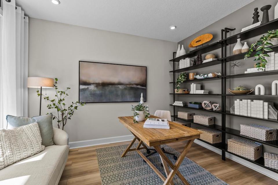 A room with a table and shelves.