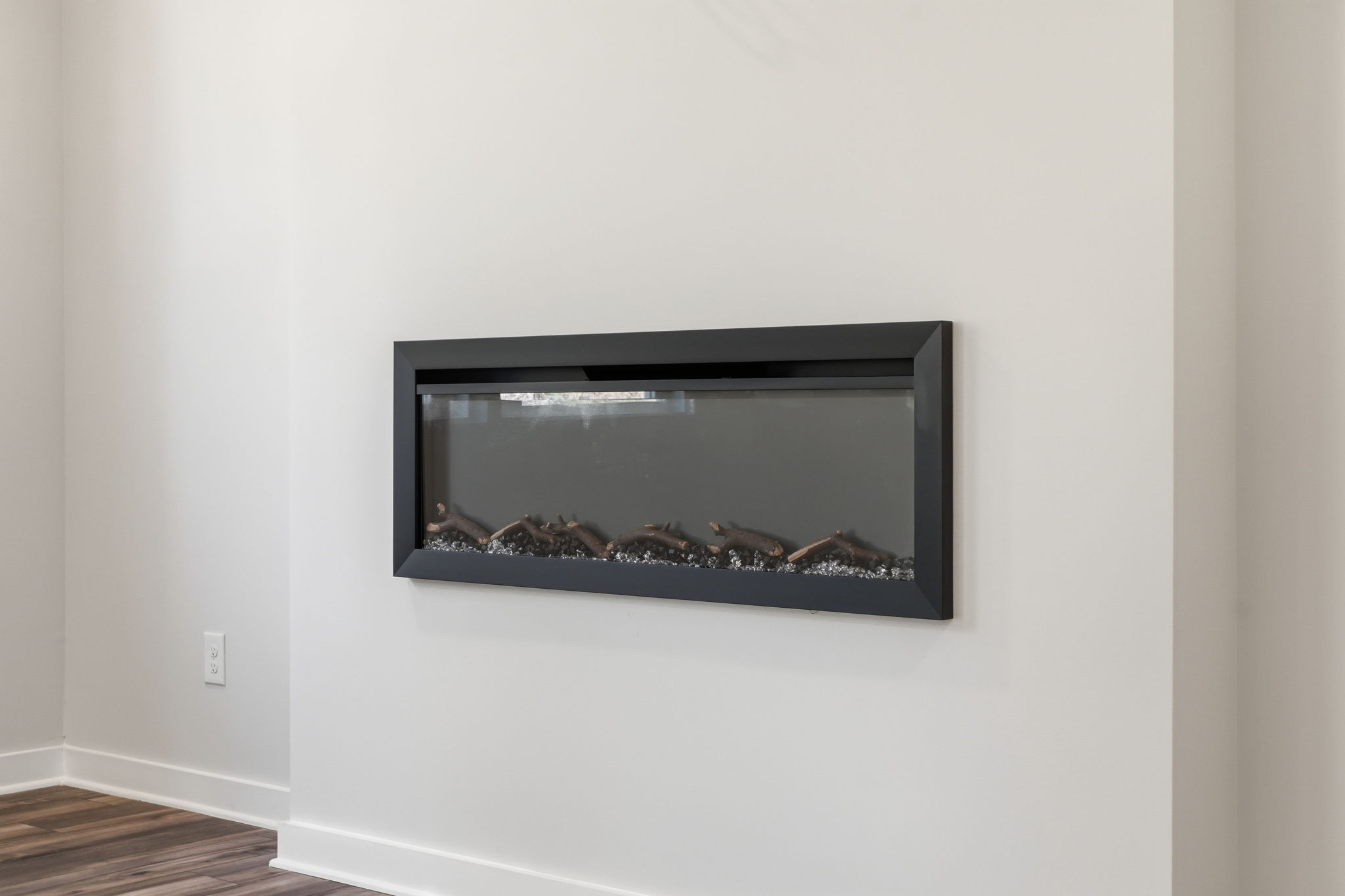 A black television on a wall.