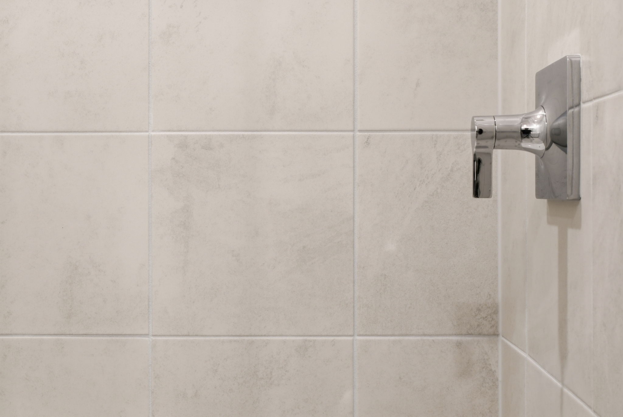 A white tiled wall.