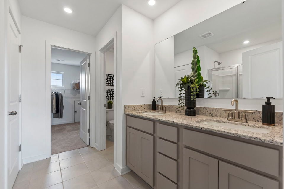 A bathroom with a marble countertop.
