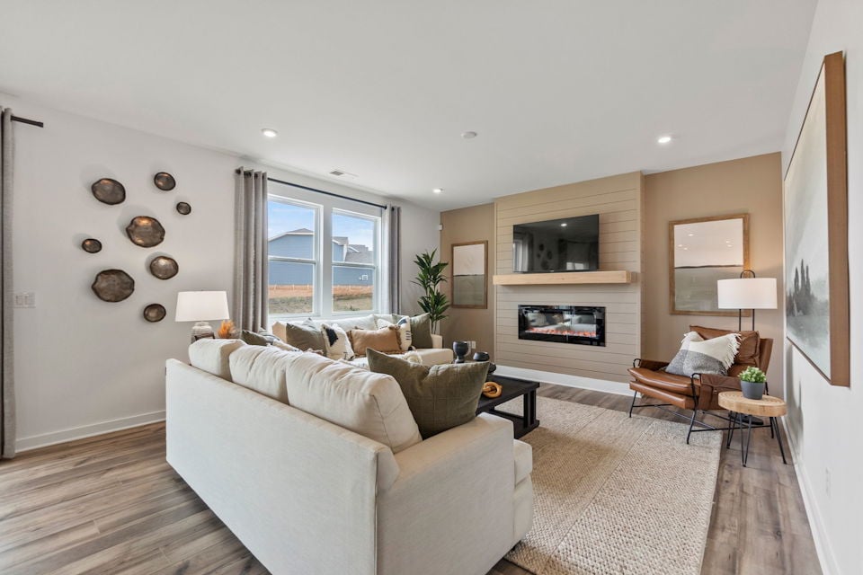 A living room with a fireplace.