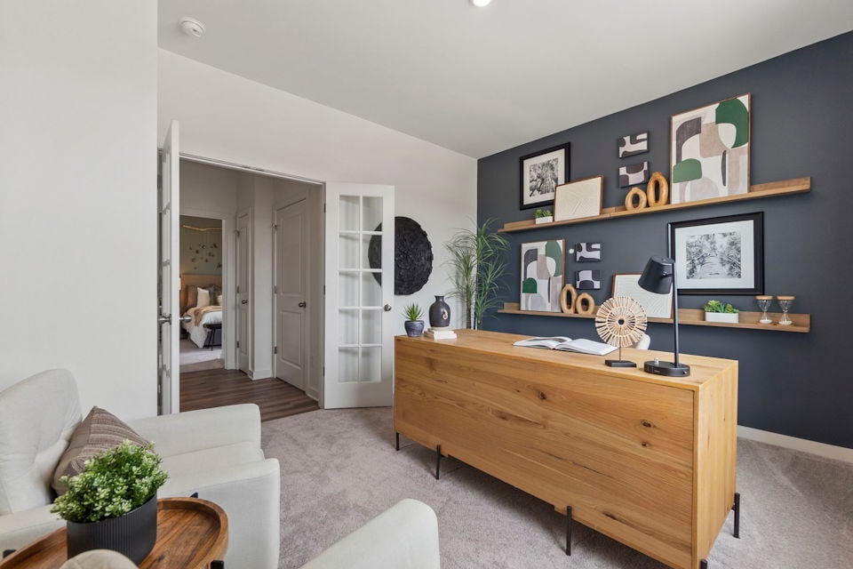 A room with a desk and a chair.