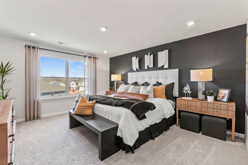 A bedroom with a large bed.